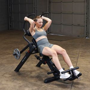 The Body-Solid GAB300B Semi-Recumbent Ab Bench is designed with a 5-position adjustable seat, a 5-position upper ab arm, and a 4-position lower ab leg support, allowing users of all sizes to customize the bench for a personalized workout experience. 
